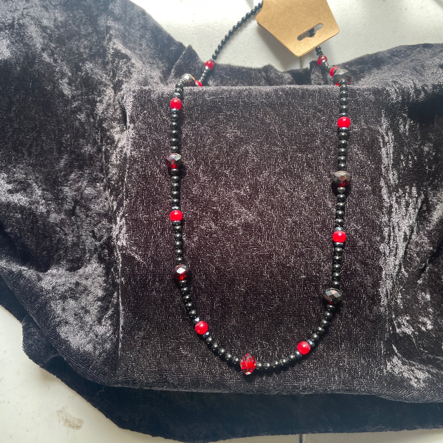 Necklace, obsidian and red crystal
