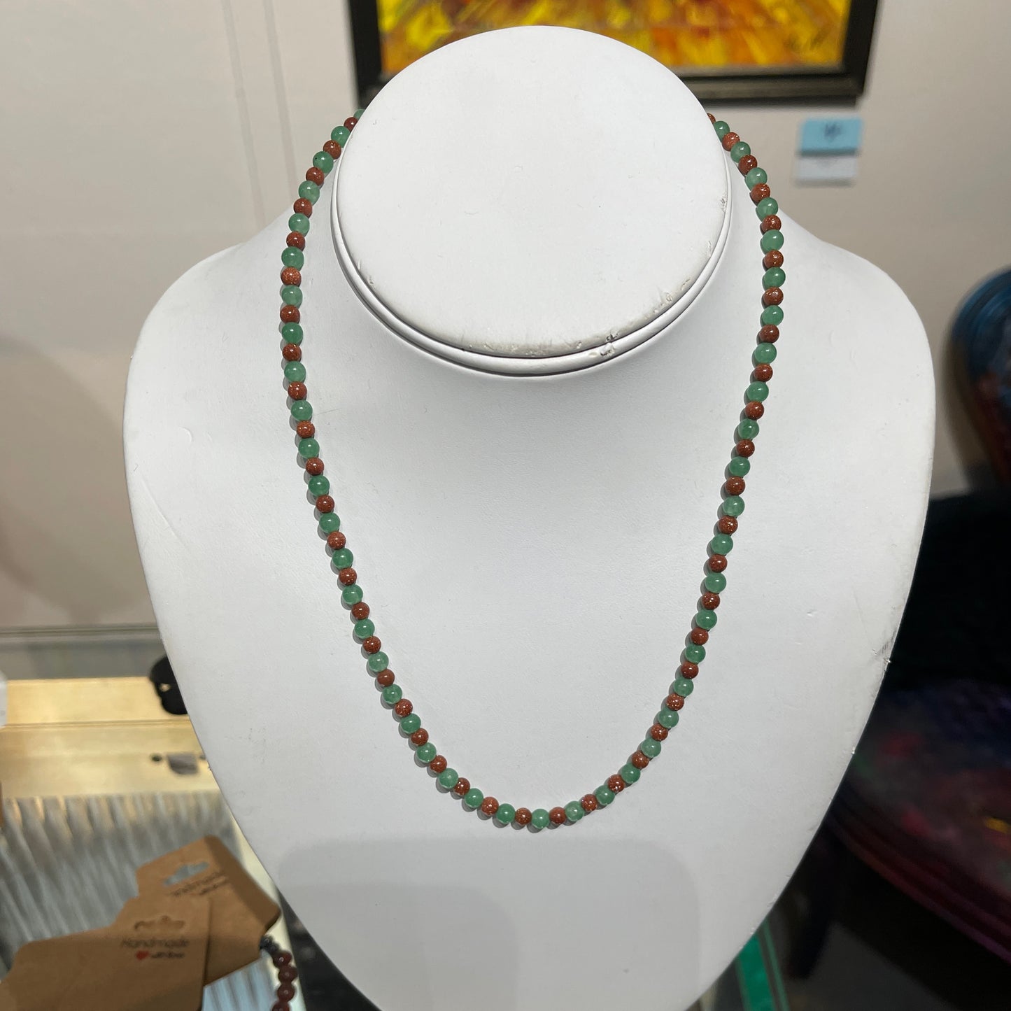 Necklace, goldstone and jade
