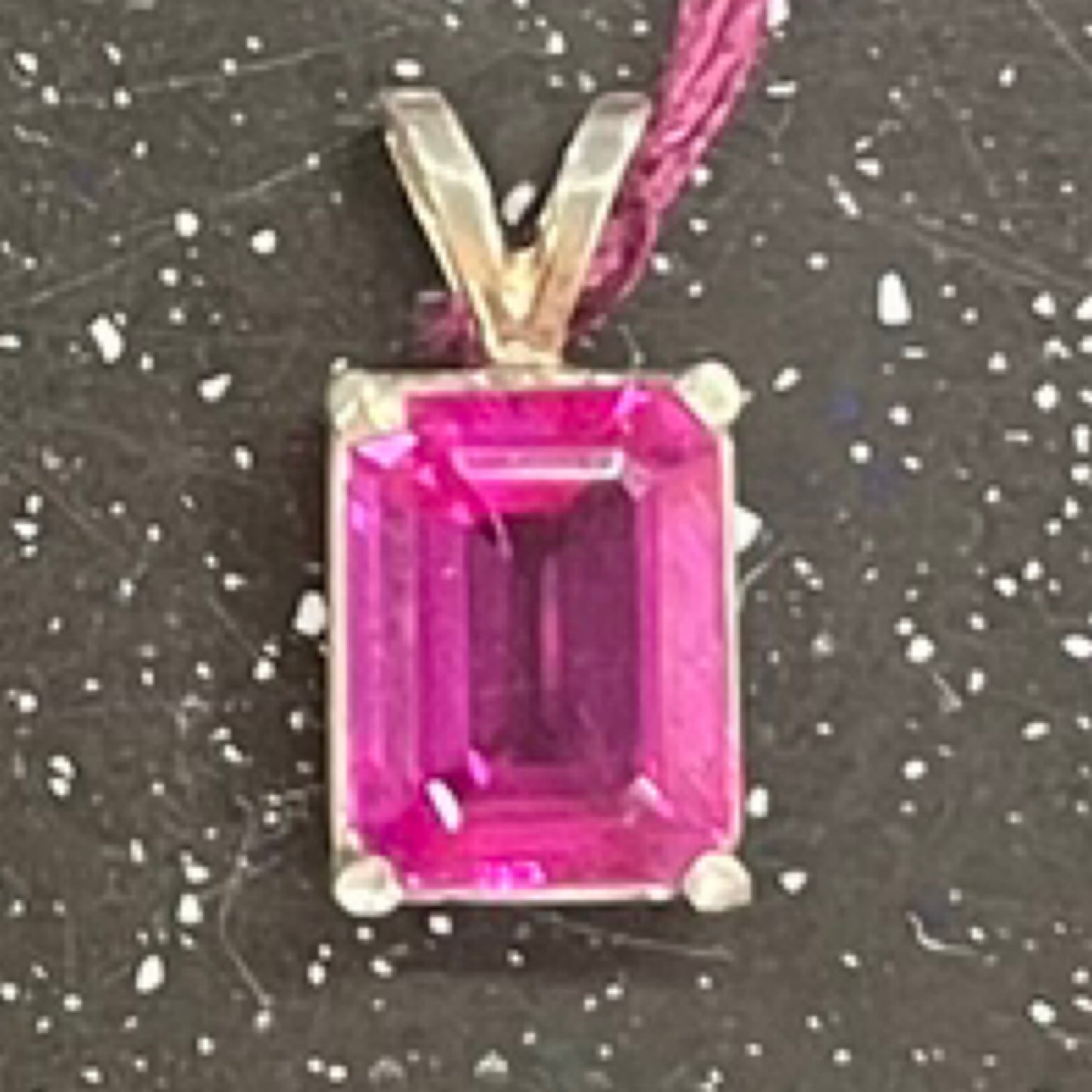 Pendant, pink sapphire, emerald cut