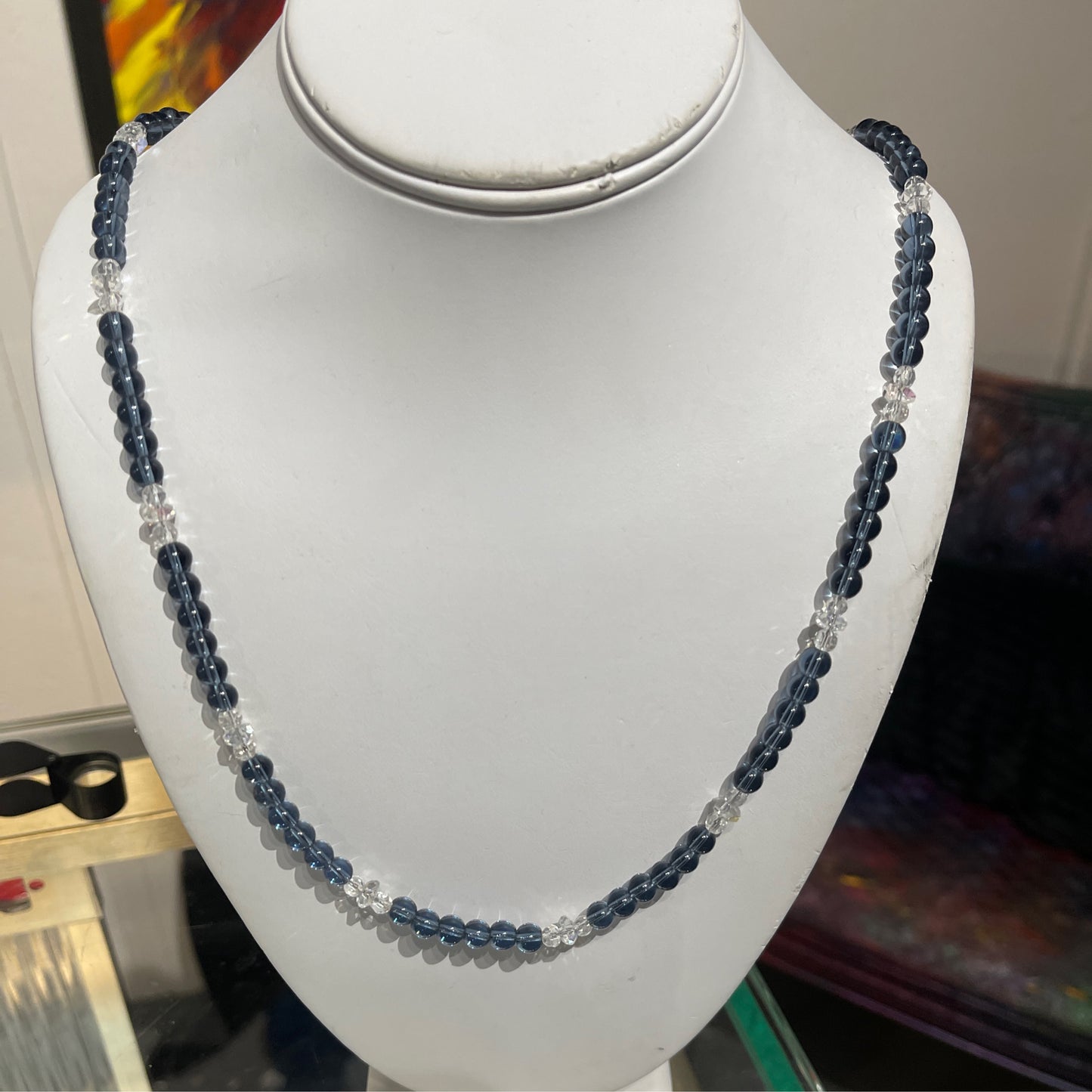 Necklace, blue and clear glass
